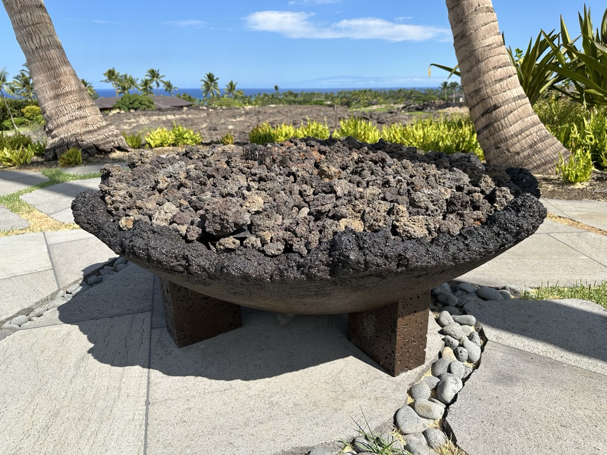Flames in an outdoor fire bowl at night